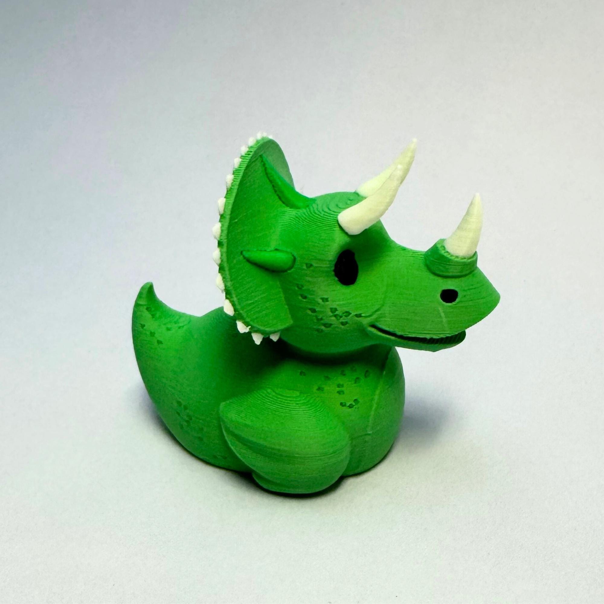 Triceratops Cruise Duck Gift Dinosaur Hide and Seek Duck with Sensory Horns Green Dino Ship Duck Collectible Stress Relief Cruise Keepsake